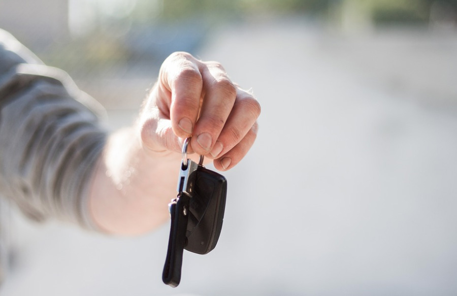 handing keys dollar car rental insurance fees